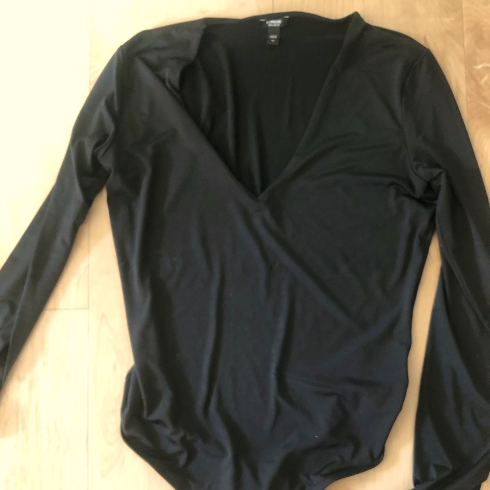 Long sleeve body contour thong bodysuit.